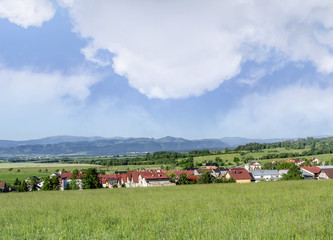 Village in the background of mountains.