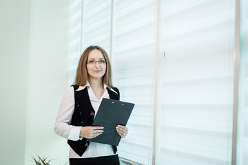 Modern business woman in the office with copy space,Business woman portrait,Successful business woman looking confident and smiling,business woman in glasses,copy space