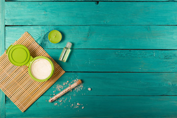 Skincare essentials on a wooden background