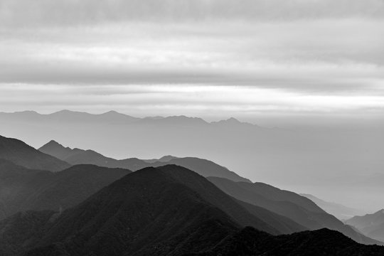 Black and white photo view to the foggy mountains from the summit of Mitsutōge in Japan