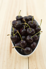 White bolw  with ripe cherries