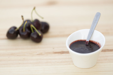 White bolw  with ripe cherries