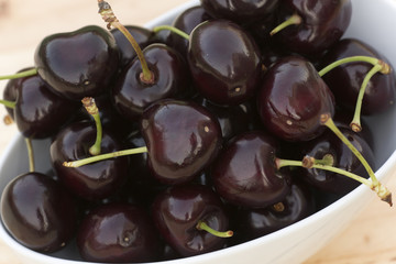 White bolw  with ripe cherries
