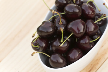 White bolw  with ripe cherries