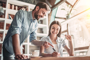 Couple working in cafe