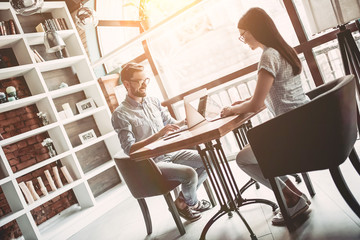 Couple working in cafe