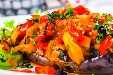 Stuffed eggplant with fried vegetables