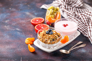 Healthy breakfast - muesli, yogurt and fruits. Selective focus. Copy space. Top view