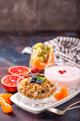 Healthy breakfast - muesli, yogurt and fruits. Selective focus. Copy space. Top view