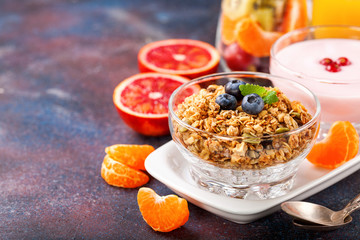 Healthy breakfast - muesli, yogurt and fruits. Selective focus. Copy space. Top view