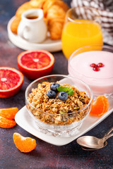 Healthy breakfast - muesli, yogurt and fruits. Selective focus. Copy space. Top view