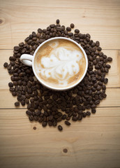 Cup of coffee with beans