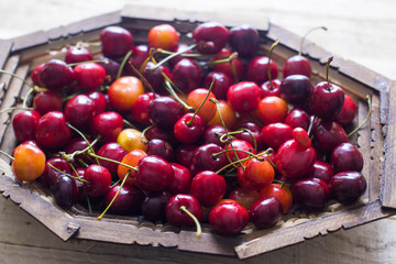Cherry berries are fresh on a wooden background. Concept of health.