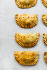 Empanadas on Grey Marble Kitchen Table