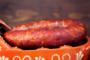 typical smoked portuguese sausage in ceramic dish