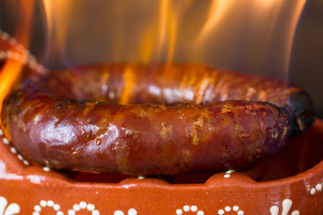 typical smoked portuguese sausage in ceramic dish