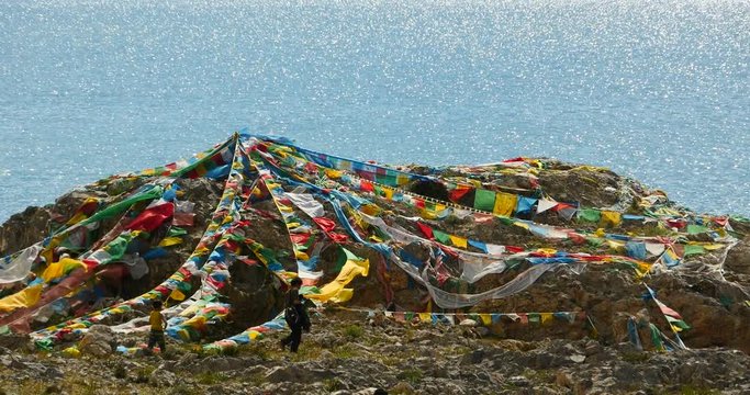 4k huge clouds mass rolling over lake namtso & Tanggula snow mountain peak,tibet mansarovar,pray flag in wind,Tibet's second largest lake,the third largest saltwater lake in China.roof of the World.
