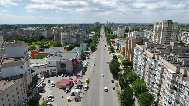 Amazing bird`s eye shot of a big city prospect with a drone flying forward in a sunny day. The lanscape and cityscape look original and impressive in Eastern Europe in summer