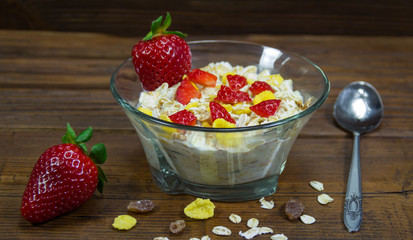 Muesli with strawberries in bowl