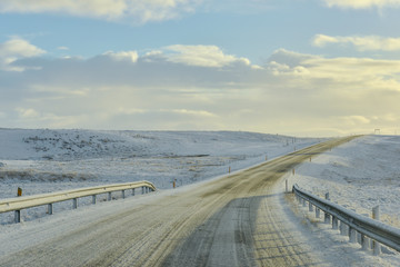 Empty road with an ocean view in winter season in Iceland