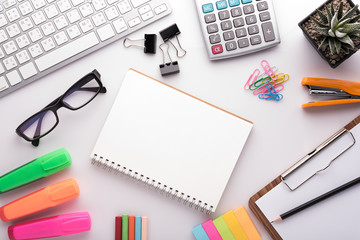White office desk table with school accessories with office supplies. Top view with copy space
