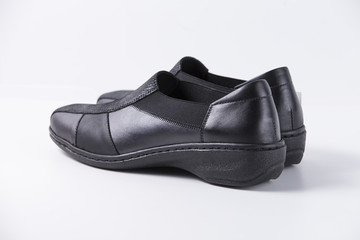 Female Black Shoe on White Background, Isolated Product, Top View, Studio.