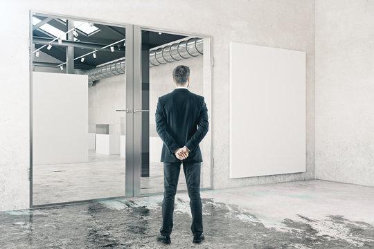 Businessman in room with whiteboard