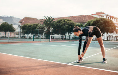 Obraz premium Young healthy girl doing stretching exercises