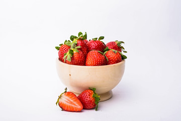 Bowl of strawberries isolated on white background
