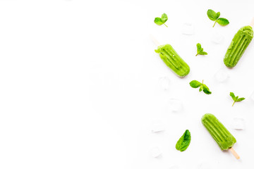 Summer dessert. Apple ice cream, mint leaves, fresh fruit, ice cubes on white background. Flat lay, top view
