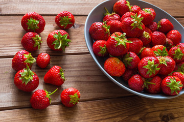 Strawberries on the wooden table.
