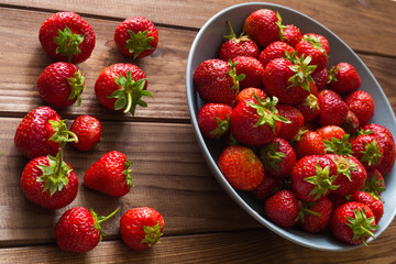 Strawberries on the wooden table.
