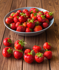Strawberries on the wooden table.
