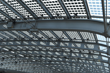 Fototapeta premium A modern and futuristic grey ceiling made with steel and glass; suitable to be used like background.