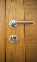 Obraz premium The keys in the lock of the room doors, locked from the inside, privacy