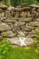 Cross on wall marking where wheel was found after explosion