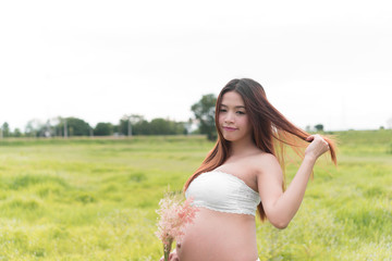 Closeup asian pregnant woman in the park,adjust color tone,thailand people