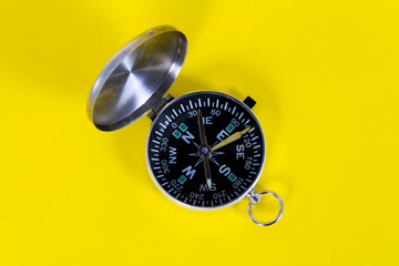 Compass on yellow background