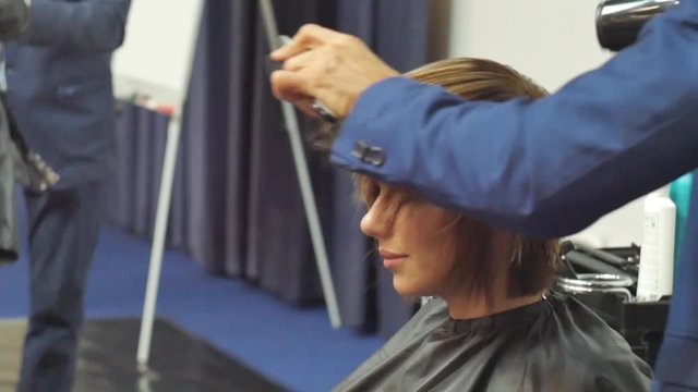 Hairdresser In Action. Barber and customers. hairstyle models for white hair. Blonde in the cabin. Work in the cabin. Barber shears white hair model client. close-up.