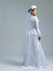 young bride in a wedding dress with a veil