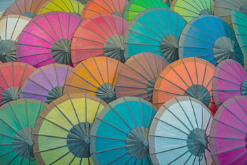 Colorful paper umbrellas on the market. Laos