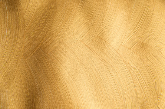 Golden glittering paintful textured background made with brush