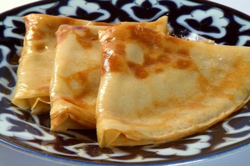 Three Pancakes on the plate with Arab Uzbek ornament  