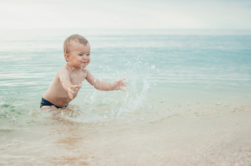 little boy swimming in sea