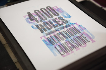 london, england, 05/05/2017 vintage wooden antique analogue typeset letter blocks being prepared for block printing.