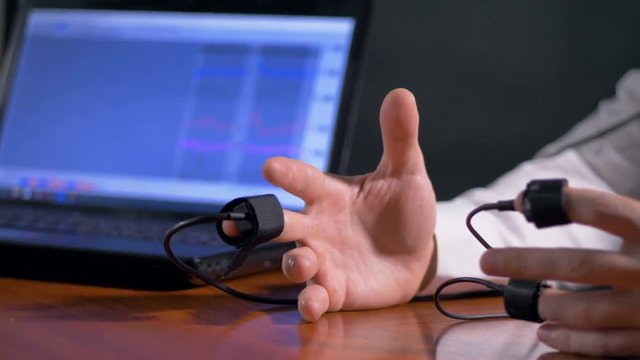Open steady hands of lie detector subject.