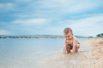 A child sitting in the sea
