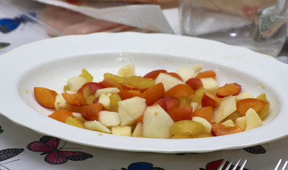 detail of fruit macedonia in a white plate