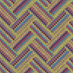 Seamless knitted pattern. Multicolored repeating tribal template