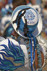 Caporales dance group in ornate costumes performing at the annual Carnaval Andino con la Fuerza del Sol in Arica, Chile